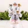 41cm Pink Sitting Santa Decoration With Skis 1 41cm Pink Sitting Santa Decoration With Skis -Christmas Decorations 1156877